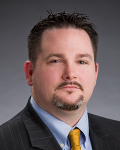 headshot of eric wilson, director of decision management analytics