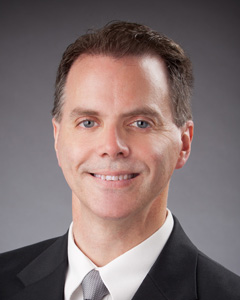 headshot of ken smith, director of partner services